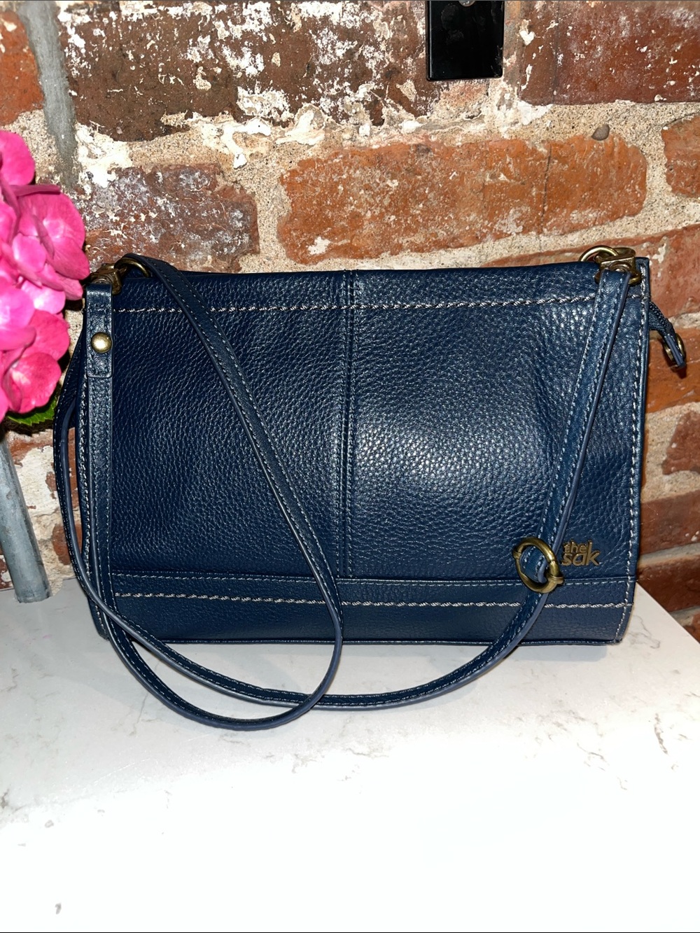 The Sak Navy Pebbled Leather Crossbody with Brass Accents